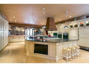 Another view of this fabulous kitchen. Note the TV installed to